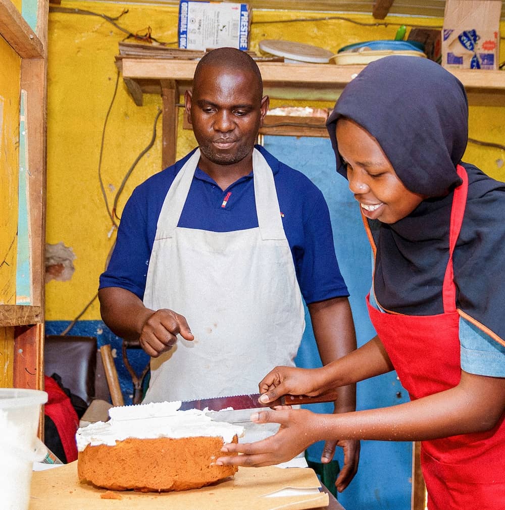 Student learning how to make a cake
